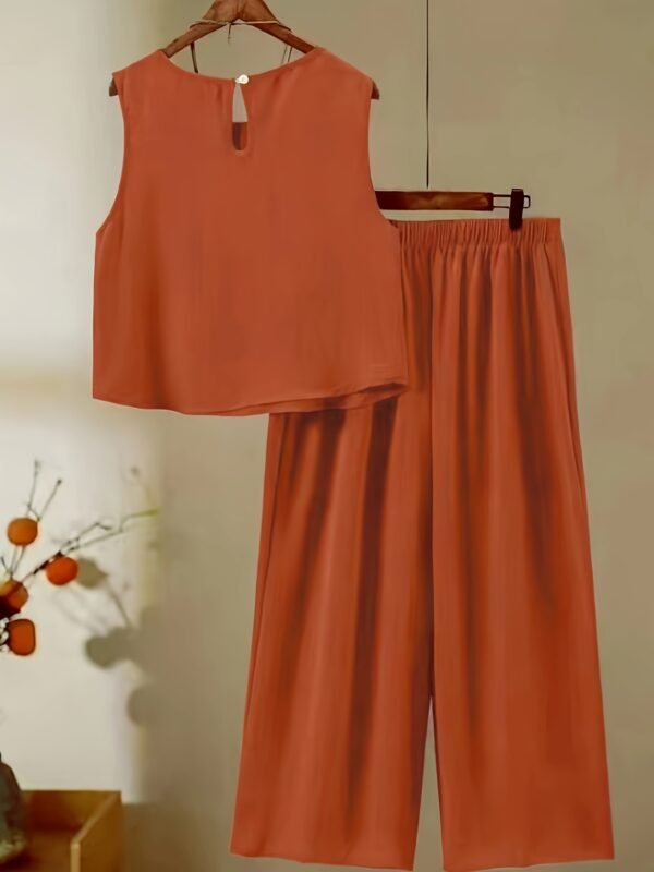 49dce4ce-1ec2-459e-b523-d561ecd5d215.jpg Women's Elegant Orange Skirt Set – Stylish Warm-Tone Fashion Outfit
